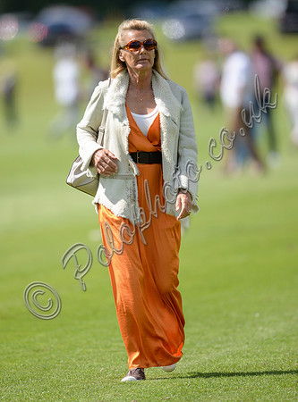 spectators and guests tread in the divots