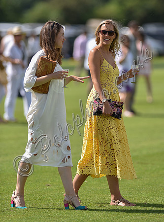 spectators and guests tread in the divots