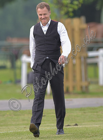 Viscount Rothermere 3 piece suit minus jacket, white shirt, walking towards