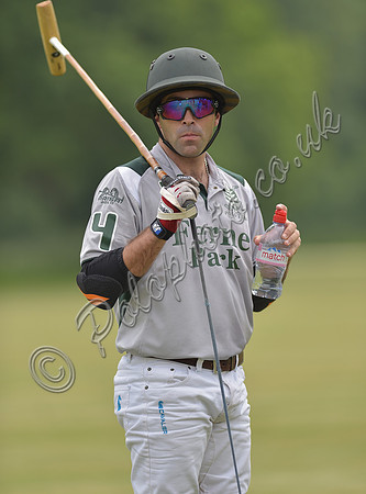 Ignacio Negri stood with mallet over shoulder and bottle of water in hand