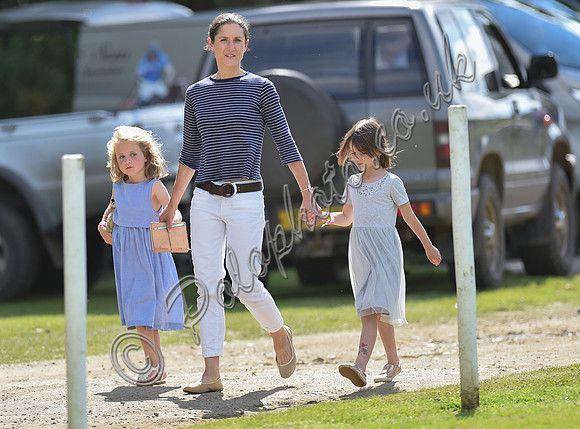 spectators and guests tread in the divots
