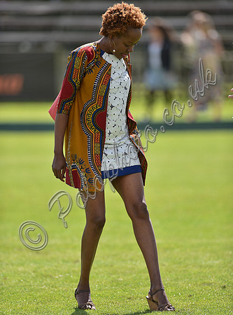 spectators and guests tread in the divots