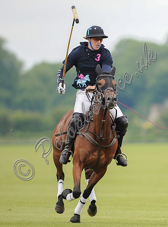 Rupert Lewis wearing Coxwell, Zonkey Polo shirt riding towards on pony with black fly mask