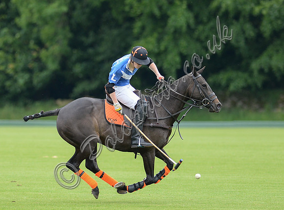 polo action of Ollie Severn riding from left to right