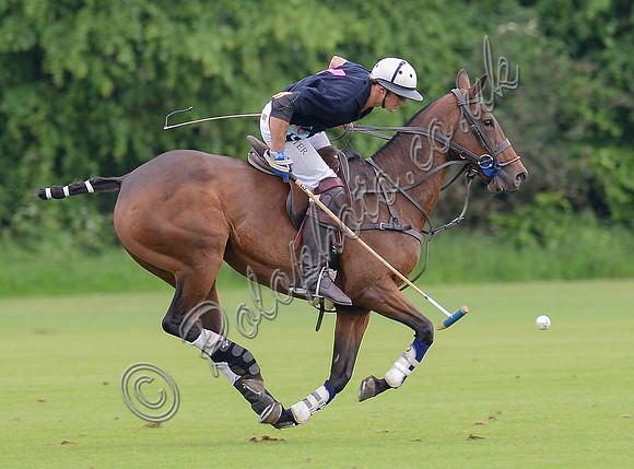 full horse left to right polo action shot of Lochie Hunter
