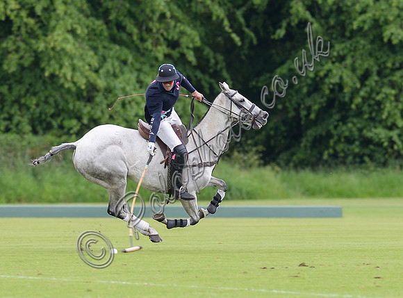 polo action shot left to right Rupert Lewis riding grey polo pony between Lodge Service and Coxwell in the Humphrey Guiness PlateFinal