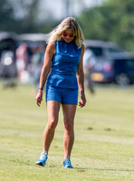 Fashionable female treading in the divots