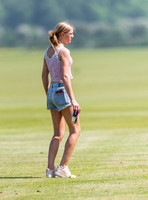 Fashionable female treading in the divots