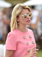 Maria Dykalos wearing pink dress with buttoned detail.