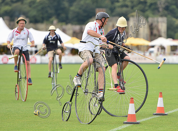 Penny Farthing Polo with the Cowdray Ruins behind