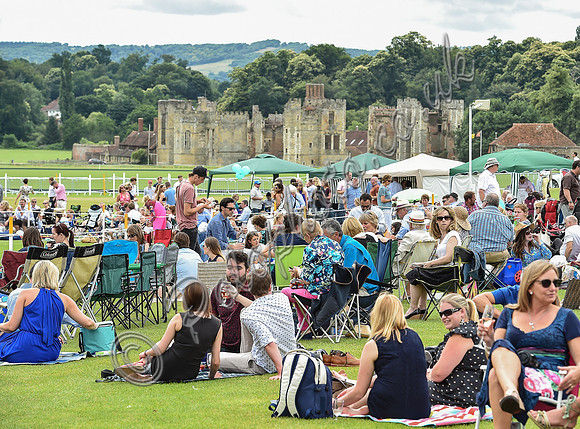 Spectators picnicing with the fabulous Cowdray Ruins as a backdrop