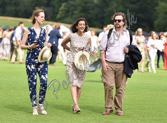 Zahra Kassim-Lakha with others, treading in the divots