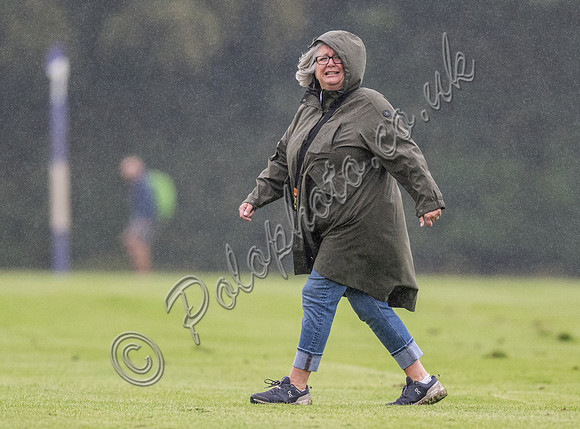 treading the divots on a rainy day at polo
