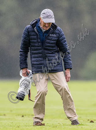 treading the divots on a rainy day at polo