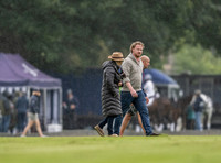 treading the divots on a rainy day at polo