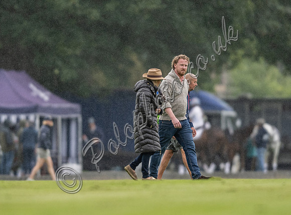 treading the divots on a rainy day at polo