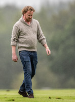 treading the divots on a rainy day at polo
