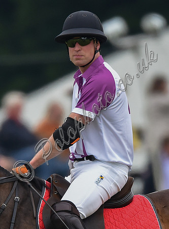 Prince William playing polo