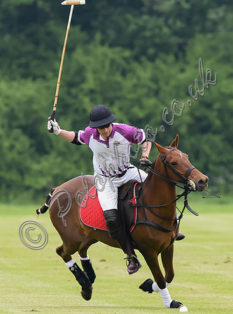 Prince William playing polo