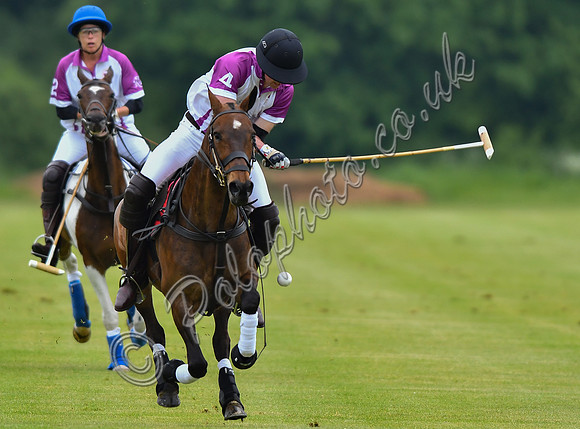 Prince William playing polo
