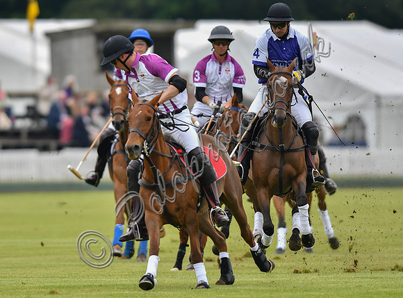 Prince William playing polo