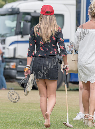 Treading in the divots at half-time at polo match