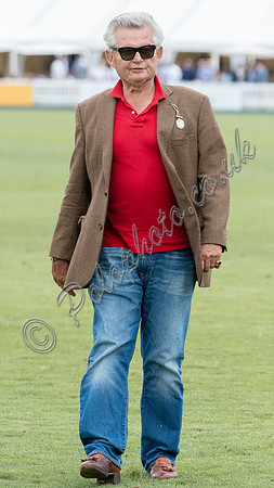 Treading in the divots at half-time at polo match