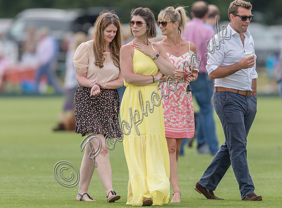 Treading in the divots at half-time at polo match
