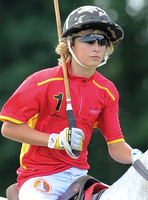 Alexander Horvat on horseback wearing sunglasses and polo helmet