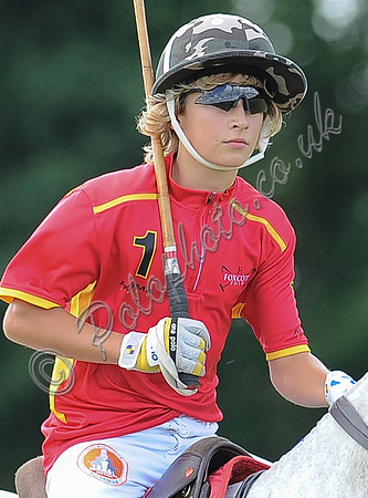 Alexander Horvat on horseback wearing sunglasses and polo helmet