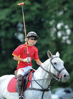 Alexander Horvat on horseback wearing sunglasses and polo helmet