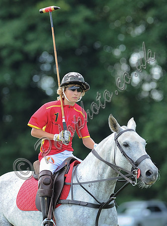 Alexander Horvat on horseback wearing sunglasses and polo helmet