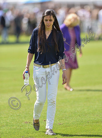 spectators and guests tread in the divots