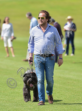 spectators and guests tread in the divots