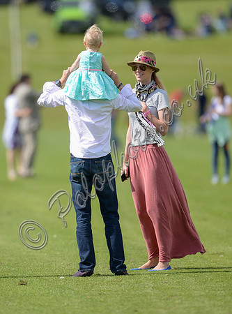 spectators and guests tread in the divots
