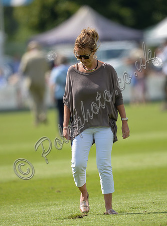 spectators and guests tread in the divots