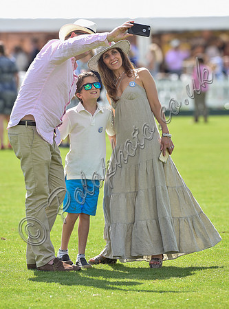 spectators and guests tread in the divots