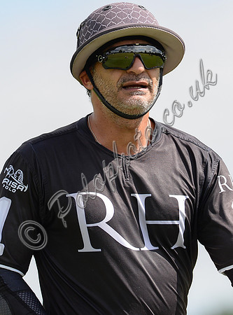 close up portrait of Ben Soleimani in RH polo shirt wearing helmet.