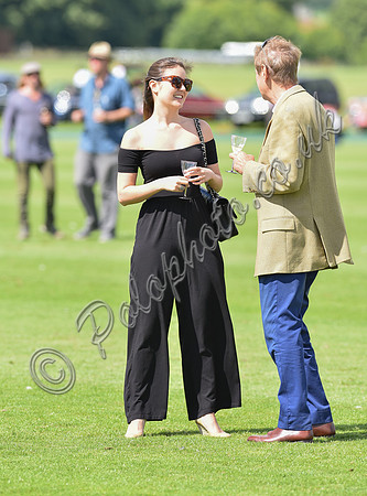 spectators and guests tread in the divots