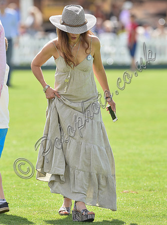 spectators and guests tread in the divots